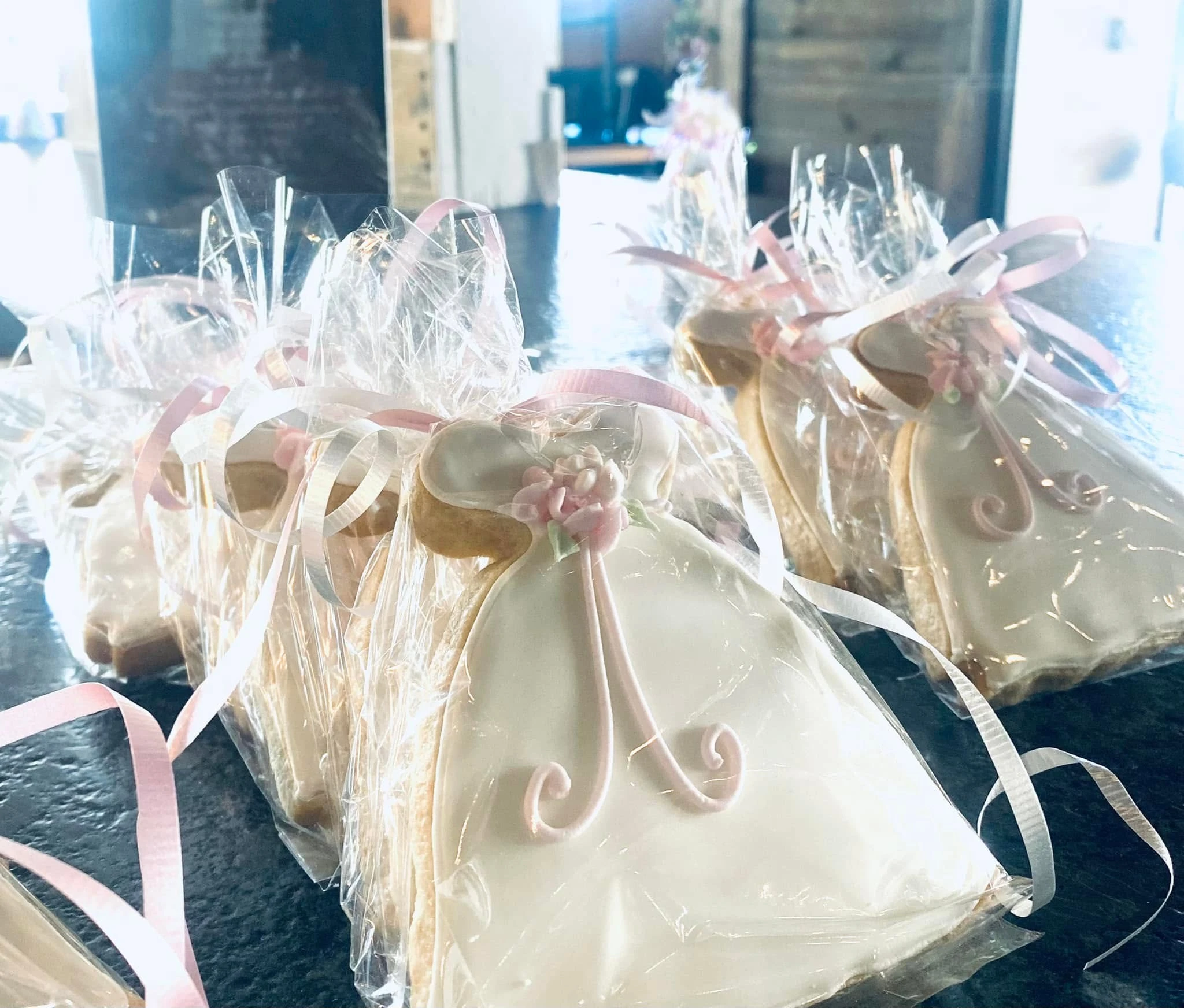 Individually wrapped dress-shaped celebration favors